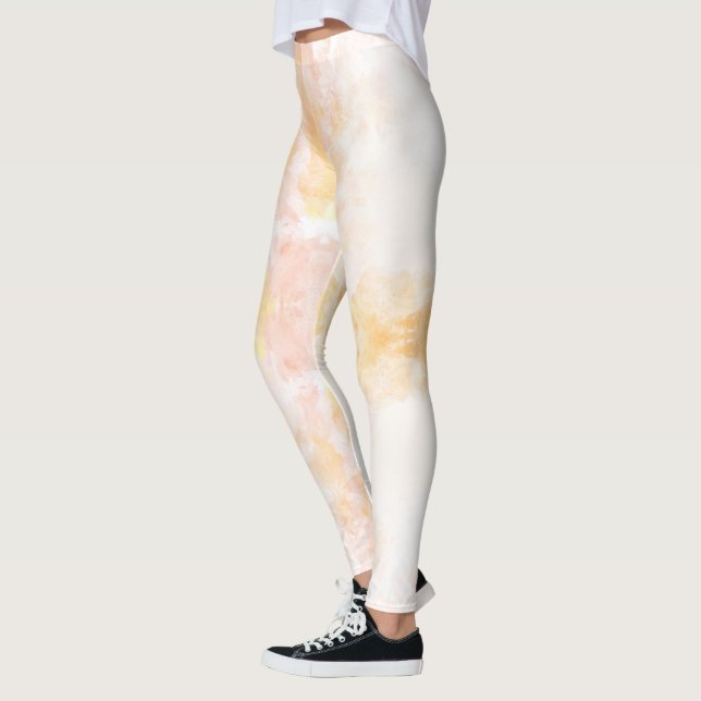 Person wearing leggings with a soft, pastel (Left)
