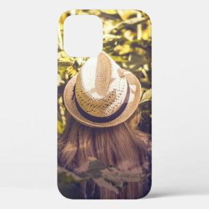 Person wearing white hat beside sunflower fields iPhone 12 case