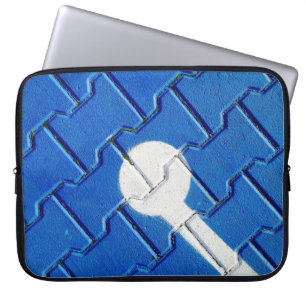 Person with wheelchain marked on purple pavement laptop sleeve