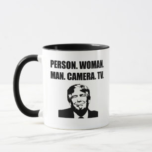 Person. Woman. Man. Camera. TV. Anti-Trump Mug