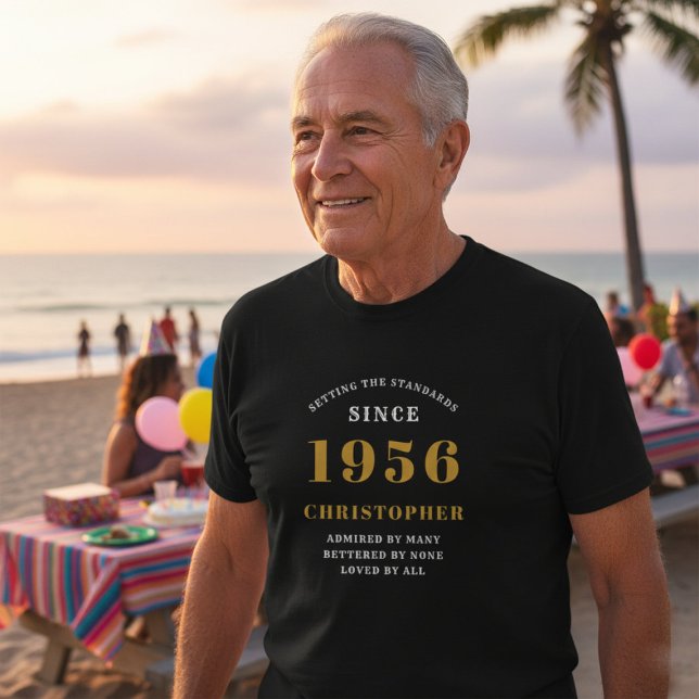 Personalised 70th Birthday 1956 Name Black Gold T-Shirt (70th birthday black tshirt worn at the beach.)