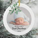 Personalised Baby's First Christmas Foliage Photo Ceramic Ornament<br><div class="desc">This Baby's First Christmas Ornament is decorated with green watercolor mistletoe. Easily customisable with your baby's photo, name, and year. Use the Design Tool to change the text size, style, or colour. Because we create our artwork you won't find this exact image from other designers. Original Watercolor © Michele Davies....</div>