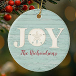 Personalised Beach Sand Dollar Christmas Joy Ceramic Ornament<br><div class="desc">A joyful Christmas ornament with a sand dollar and a weathered wood background for your Christmas Beach decor. Personalise it for yourself,  or for a gift! Designed for you by Blackberry Boulevard.</div>