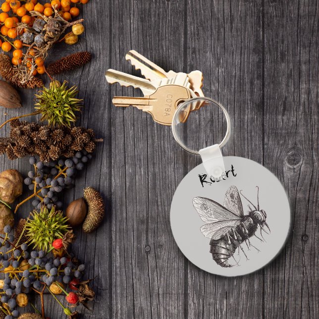 Personalised Bee With Skull Wings Keychain (Big scary bee with skull crossbones on wings on grey keychain.)