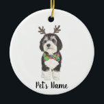 Personalised Bernedoodle Reindeer Bowtie Christmas Ceramic Ornament<br><div class="desc">I am in love with this beautifully detailed watercolor illustration of a grey, black, and white bernedoodle or sheepadoodle on an ornament with a sweet little antler and red & green bowtie combo! Personalise these ornaments and make the nice list this year! For the perfect presents, pair it with a...</div>