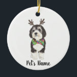 Personalised Bernedoodle Reindeer Bowtie Christmas Ceramic Ornament<br><div class="desc">I am in love with this beautifully detailed watercolor illustration of a grey, black, and white bernedoodle or sheepadoodle on an ornament with a sweet little antler and red & green bowtie combo! Personalise these ornaments and make the nice list this year! For the perfect presents, pair it with a...</div>