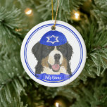 Personalised Bernese Mountain Dog Hanukkah Blue Ceramic Ornament<br><div class="desc">Celebrate your favourite mensch on a bench with personalised ornament! This design features a sweet illustration of a Bernese Mountain Dog with a blue and white yarmulke. For the most thoughtful gifts, pair it with another item from my collection! To see more work and learn about this artist, visit her...</div>