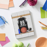Personalised Black and White Basketball Jersey iPad Pro Cover<br><div class="desc">If you require this design in a different colour combination for your basketball team colours, please contact us via our GiftsBonanza store prior to purchase and we will be happy to assist with your custom request. Other team colours available in store. Customisable black and white basketball jersey hanging in a...</div>