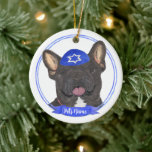 Personalised Black Brindle Frenchie Hanukkah Ceramic Ornament<br><div class="desc">Celebrate your favourite mensch on a bench with a personalised ornament! This design features a sweet illustration of a black or brindle french bulldog dog with a blue and white yarmulke. For the most thoughtful gifts, pair it with another item from my collection! To see more work and learn about...</div>