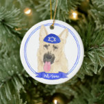 Personalised Black & Tan German Shepherd Hanukkah Ceramic Ornament<br><div class="desc">Celebrate your favourite mensch on a bench with personalised ornament! This design features a sweet illustration of a black and tan german shepherd dog with a blue and white yarmulke. For the most thoughtful gifts, pair it with another item from my collection! To see more work and learn about this...</div>