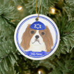 Personalised Blenheim Cavalier Hanukkah Yarmulke Ceramic Ornament<br><div class="desc">Celebrate your favourite mensch on a bench with personalised ornament! This design features a sweet illustration of a red and white or blenheim cavalier king charles spaniel dog with a blue and white yarmulke. For the most thoughtful gifts, pair it with another item from my collection! To see more work...</div>
