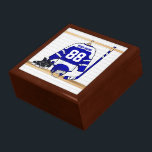 Personalised Blue and White Ice Hockey Jersey Gift Box<br><div class="desc">A personalised ice hockey jersey in blue and white hanging in a sports locker room with a helmet, ice skates and an ice hockey stick. The jersey can be fully customised with the number and name of your choice to make a great gift for the ice hockey fan, ice hockey...</div>