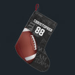 Personalised Chalkboard American Football Small Christmas Stocking<br><div class="desc">A modern American football grid iron design featuring a football on a chalkboard typography background with football terminology in the background. The design features customisable text for the name and number of the football player or grid iron fan. This design has been made in part with graphics licensed by Graphics...</div>