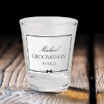 Personalised Classic Simple Bowtie Groomsman Shot Glass<br><div class="desc">This personalised shot glass makes the perfect gift for your groomsmen! Featuring a chic, minimalist design with elegant script text, a bowtie icon, and a customisable name and wedding date, it adds a sophisticated touch to your special day. Whether you’re toasting at the bachelor party or celebrating during the wedding...</div>