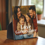 Personalised Family Photo Love Gathers Here Plaque<br><div class="desc">Celebrate the heart of your home with this personalised photo plaque,  featuring your favourite family moment and custom last name. A warm and meaningful accent for shelves,  desks,  or mantels — perfect for holidays,  housewarmings,  or everyday reminders of togetherness.</div>