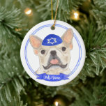 Personalised Fawn Tan Frenchie Dog Hanukkah Ceramic Ornament<br><div class="desc">Celebrate your favourite mensch on a bench with a personalised ornament! This design features a sweet illustration of an entlebucher mountain dog with a blue and white yarmulke. For the most thoughtful gifts, pair it with another item from my collection! To see more work and learn about this artist, visit...</div>