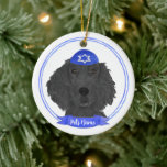 Personalised Flat Coated Retriever Dog Hanukkah Ceramic Ornament<br><div class="desc">Celebrate your favourite mensch on a bench with a personalised ornament! This design features a sweet illustration of a black flat coated retriever dog with a blue and white yarmulke. For the most thoughtful gifts, pair it with another item from my collection! To see more work and learn about this...</div>