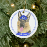 Personalised German Shepherd Dog Hanukkah Ceramic Ornament<br><div class="desc">Celebrate your favourite mensch on a bench with a personalised ornament! This design features a sweet illustration of a german shepherd dog with a blue and white yarmulke. For the most thoughtful gifts, pair it with another item from my collection! To see more work and learn about this artist, visit...</div>