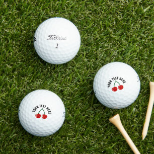 Personalised golf balls with red cherry fruit logo