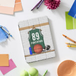 Personalised Green and White Basketball Jersey iPad Pro Cover<br><div class="desc">Green and white basketball jersey hanging in a locker room with a basketball , basketball sneakers and a drinks bottle. The jersey is customisable with your own numbers and name, to create a truly unique gift for the Basketball player or basketball fan. If you require a different colour combination contact...</div>