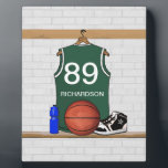 Personalised Green and White Basketball Jersey Plaque<br><div class="desc">Personalised Green and white basketball jersey hanging in a locker room with a basketball , basketball sneakers and a drinks bottle. The jersey is customisable with your own numbers and name, to create a truly unique gift for the Basketball player or basketball fan. If you require a different colour combination...</div>
