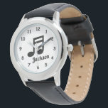 Personalised kid's watch with name and music note<br><div class="desc">Personalised kid's watch with custom name and music note icon design. Personalised wrist watches for boys and girls. Cute Holiday or Birthday gift idea for son, daughter, grandson, granddaughter, piano player, guitar player, musician, student, nephew, cousin, teacher, children etc. Black and white design with script typography. Diameter around 33 mm....</div>