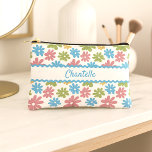 Personalised Makeup Bag With Retro Floral Pattern<br><div class="desc">This toiletry bag, travel accessories, or make-up essentials pouch design features a stunning combination of blush pink, light sky blue, spring green, and corn yellow coloured floral pattern on a crisp white background. The variety of this colour combo creates a sunny and girly summer effect. The pattern is ornate and...</div>