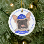 Personalised Masked Frenchie Hanukkah Ceramic Ornament<br><div class="desc">Celebrate your favourite mensch on a bench with a personalised ornament! This design features a sweet illustration of a fawn masked frenchie or french bulldog with a blue and white yarmulke. For the most thoughtful gifts, pair it with another item from my collection! To see more work and learn about...</div>