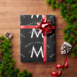 Personalised Merry Christmas Black Monogram Wrapping Paper<br><div class="desc">A personalised stylish "Merry Christmas" monogram design with a Xmas back background colour. An ideal festive custom design for the holiday season. Customise the monogram and make it your own!</div>