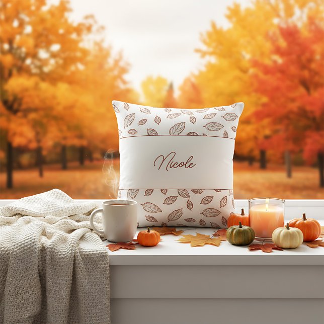 Personalised Minimalist Farmhouse        Leaf Fall Cushion (A cozy farmhouse pillow with a fall theme, featuring a white background and scattered brown leaves.)