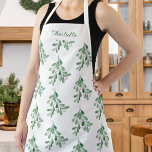 Personalised Mistletoe Pattern Apron<br><div class="desc">This Christmas apron is decorated with watercolor mistletoe greenery.
Easily customisable.
Because we create our artwork you won't find this exact image from other designers.
Original Watercolor © Michele Davies.</div>