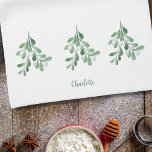 Personalised Mistletoe Tea Towel<br><div class="desc">This Christmas kitchen towel is decorated with watercolor mistletoe foliage and berries.
Easily customisable with your name or monogram.
Use the Design Tool to change the text size,  style,  or colour.
As we create our artwork you won't find this exact image from other designers.
Original Watercolor © Michele Davies.</div>