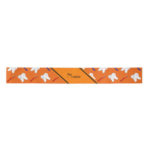 Personalised name orange brushes and tooth pattern satin ribbon