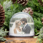 Personalised Photo Names Wedding Date Keepsake Snowglobe<br><div class="desc">Celebrate a love story with a charming keepsake that captures the moment forever. This personalised wedding snow globe features a custom photo on one side and the couple’s names with their wedding date on the other, creating a meaningful memento of the big day. Perfect as a wedding gift for the...</div>