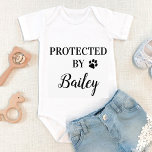 Personalised Protected By Dog Baby Bodysuit<br><div class="desc">Protected By, Dog Security ! Let everyone know of your best dog and newly appointed guard dog in the welcoming home of your new baby with this cute dog baby clothes. “Protected By... your dogs name" with paw print. Perfect baby shower gift to a dog mum, this dog lover baby...</div>