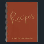 Personalised Recipe Journal in Burnt Orange Gold<br><div class="desc">Stay organised in style with this personalised recipe journal in burnt orange and golden text. This chic journal allows you to add your name for a custom touch. Inside, you'll find plenty of recipe pages to fill out, making it the perfect gift for home cooks, bakers, or anyone who loves...</div>