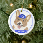 Personalised Red and White Corgi Dog Hanukkah Ceramic Ornament<br><div class="desc">Celebrate your favourite mensch on a bench with personalised ornament! This design features a sweet illustration of a red and white corgi dog with a blue and white yarmulke. For the most thoughtful gifts, pair it with another item from my collection! To see more work and learn about this artist,...</div>