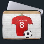 Personalised Red and White Football Soccer Jersey Laptop Sleeve<br><div class="desc">A personalised football soccer jersey in red with white trim, hanging in a sports locker room with a water bottle, football cleats and a soccer ball. Just add the name and number (or age) of the soccer player, football fan or soccer team coach to create a unique soccer gift. Other...</div>