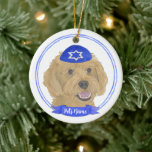Personalised Red Apricot Gold Doodle Dog Hanukkah Ceramic Ornament<br><div class="desc">Celebrate your favourite mensch on a bench with personalised ornament! This design features a sweet illustration of a red, apricot, or golden doodle dog with a blue and white yarmulke. For the most thoughtful gifts, pair it with another item from my collection! To see more work and learn about this...</div>