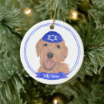 Personalised Red Apricot Gold Doodle Dog Hanukkah Ceramic Ornament<br><div class="desc">Celebrate your favourite mensch on a bench with personalised ornament! This design features a sweet illustration of a red, apricot, or golden doodle dog with a blue and white yarmulke. For the most thoughtful gifts, pair it with another item from my collection! To see more work and learn about this...</div>