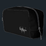 Personalised Script Monogram and Name Groomsmen Dopp Kit<br><div class="desc">Add a personal touch to your wedding with personalised groomsmen gift. This design features personalised groomsman's name in white classic script font style with wedding details in white classic serif font style and monogram in light grey classic serif font style as background on black background. Also perfect for best man,...</div>