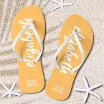 Personalised Team Bride Orange and White Thongs<br><div class="desc">Light orange and white - or any colour - flip flops personalised with your name and "Team Bride" or any wording you choose. Great bridesmaid gift, bachelorette party, flat shoes for the wedding reception, or a fun bridal shower favour. Change the colour straps and footbed, too! More colours done for...</div>