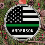 Personalised Thin Green Line A Military Christmas Metal Ornament<br><div class="desc">Thin Green Line Flag Military Ornament, a perfect addition to your Christmas decor! Show your support for the brave men and women who protect our borders, parks, and wildlife. This modern and simple ornament features the American flag with a thin green line representing federal law enforcement officers, border patrol, game...</div>