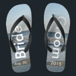 Personalised Wedding Beach Sand Thongs<br><div class="desc">Pretty Blue Sky with Light Fluffy White Clouds, Blue Sea, Crashing Ocean Waves and Beach Sand. Unisex Flip Flops with Bride and Groom Date of Marriage written in a white colour text. PERSONALIZE with your text on left and right feet, (or delete text to only show image). The wedding date...</div>