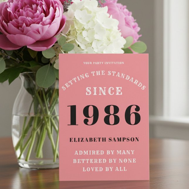 Personalized 40th Birthday 1986 Add Your Name Pink Invitation (1986 pink birthday party invitation on a table with flowers)