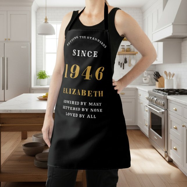 Personalized 80th Birthday 1946 Black & Gold Apron (1946 birthday apron in black and gold worn in a kitchen.)