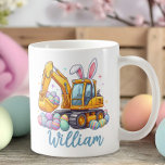 Personalized Name Easter Excavator Mug for Kids<br><div class="desc">This personalized Easter excavator mug for kids was inspired by the pure joy little ones feel when their favorite things come together — construction trucks, Easter eggs, and seeing their own name in print. The playful design features a bright yellow excavator wearing bunny ears, scooping up colorful Easter eggs, making...</div>