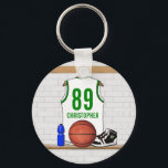 Personalized White and Green Basketball Jersey Key Ring<br><div class="desc">White and green basketball jersey hanging in a locker room with a basketball , basketball sneakers and a drinks bottle. The jersey is customizable with your own numbers and name, to create a truly unique gift for the Basketball player or basketball fan. If you require a different color combination contact...</div>