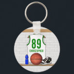 Personalized White and Green Basketball Jersey Key Ring<br><div class="desc">White and green basketball jersey hanging in a locker room with a basketball , basketball sneakers and a drinks bottle. The jersey is customizable with your own numbers and name, to create a truly unique gift for the Basketball player or basketball fan. If you require a different color combination contact...</div>