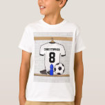 Personalized White Black Football Soccer Jersey T-Shirt<br><div class="desc">Personalised white and black football soccer jersey shirt, hanging in a sports locker room with a water bottle, football cleats and a soccer ball. Just add the name and number (or age) of the soccer player, football fan or soccer team coach to create a unique soccer gift. Other soccer team...</div>